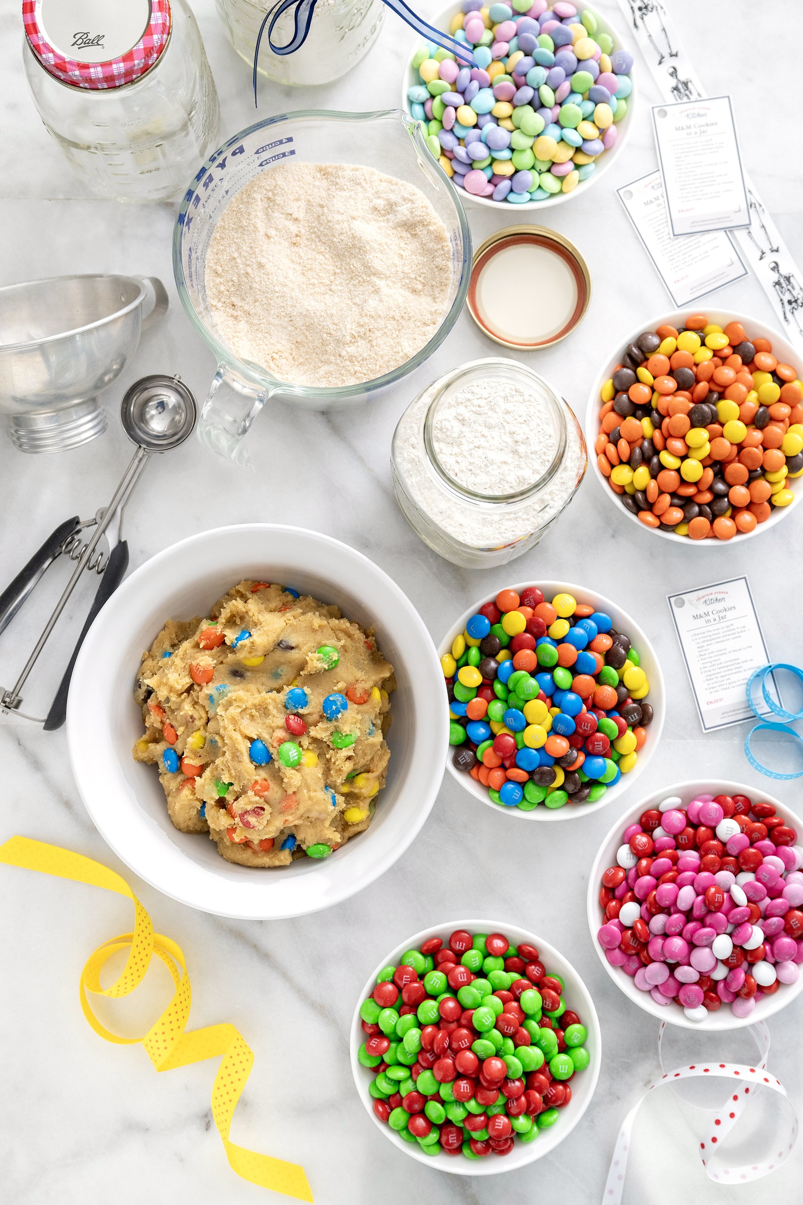 A popular holiday gift (for any holiday) and a great project for kids to make for friends, M&M Cookies in a Jar are fun to bake, give, and enjoy. Printable tags included!